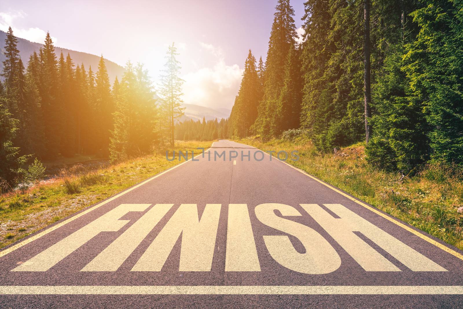 Asphalt road with finish line message. 