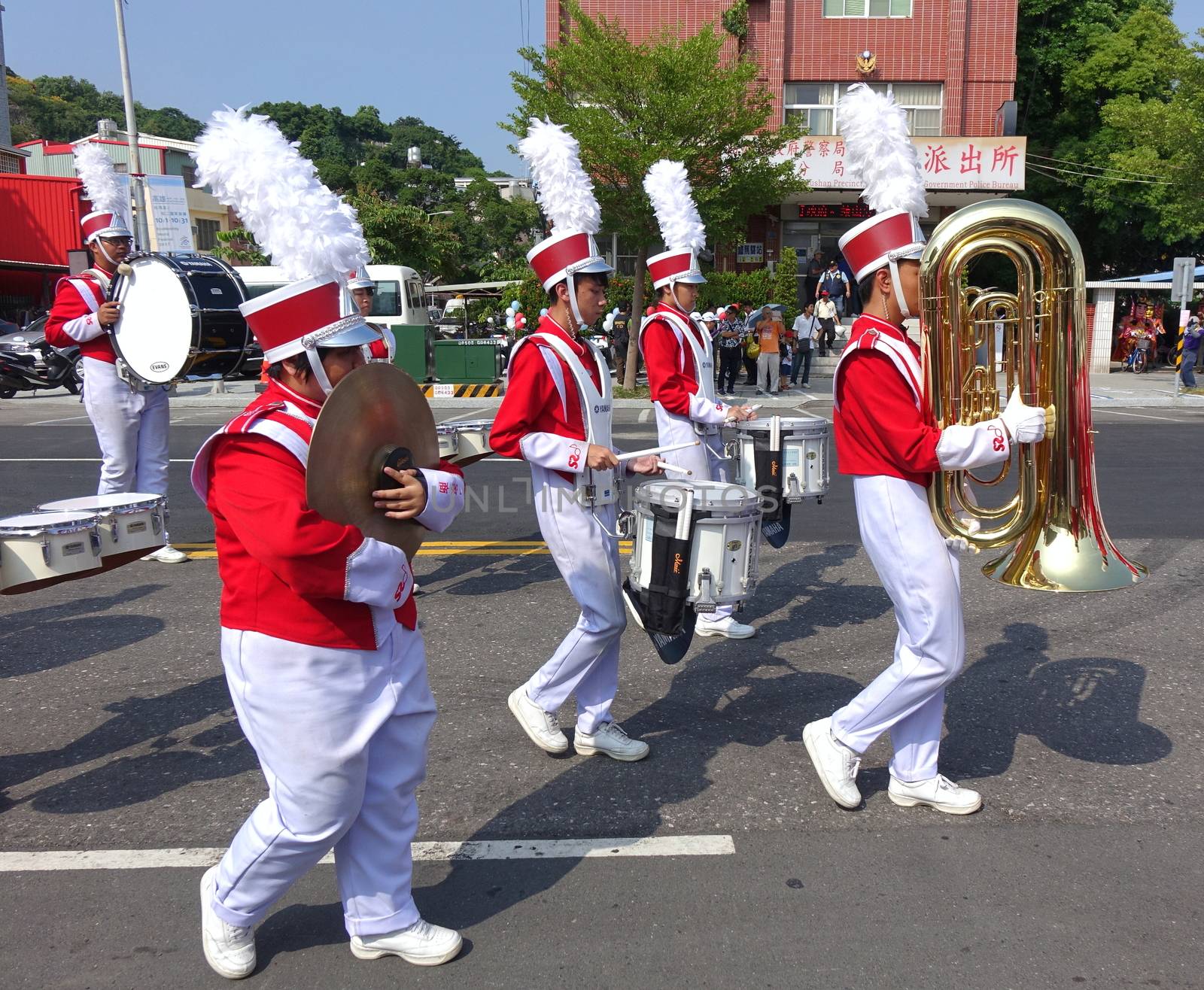 KAOHSIUNG, TAIWAN -- OCTOBER 1, 2017: A high school marching band gets ready to join a street parade at the opening of the 2017 Ecomobility Festival.