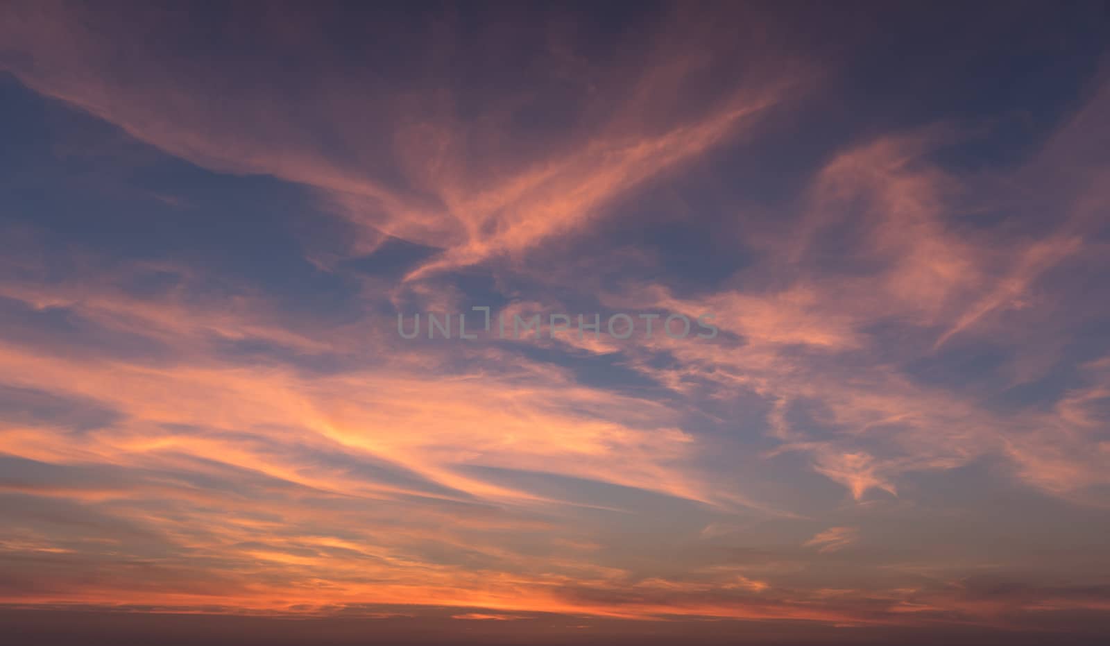 Natural Sunset Sunrise Over Field Or Meadow. Bright Dramatic Sky And Dark Ground. Countryside Landscape Under Scenic Colorful Sky At Sunset Dawn Sunrise. Sun Over Skyline, Horizon. Warm Colours.