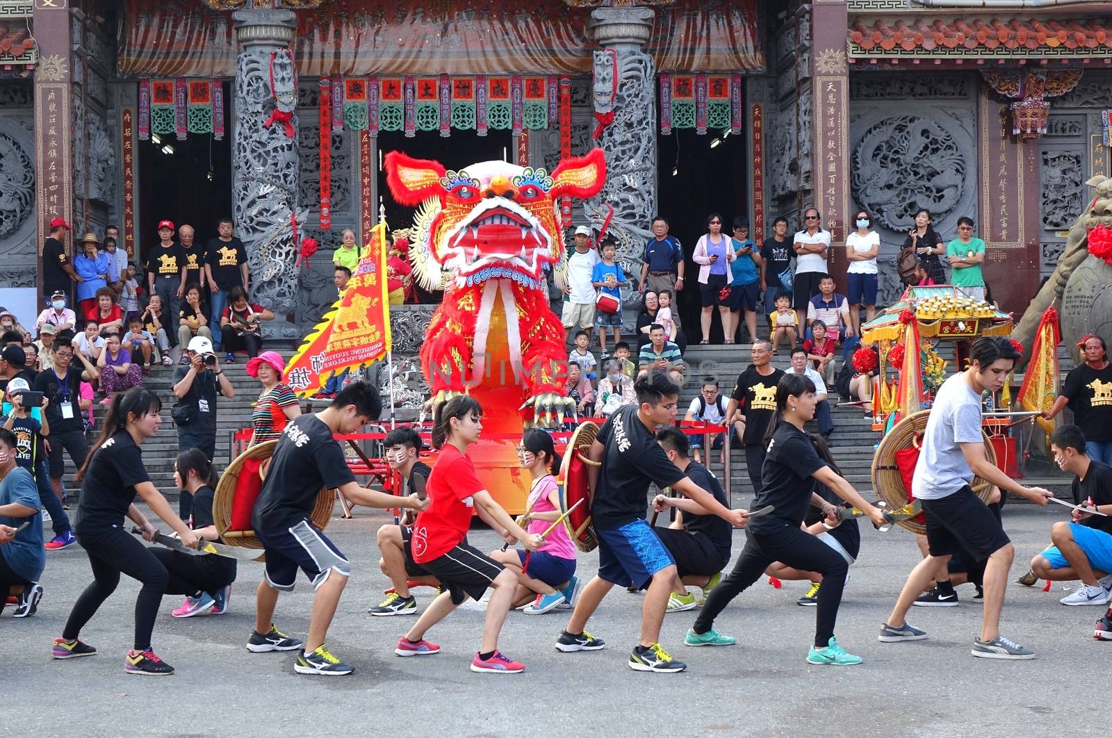 KAOHSIUNG, TAIWAN -- OCTOBER 15, 2016: Young people put on a martial art performance in front of the Yuan Di Temple during the yearly Wannian Folk Festival.