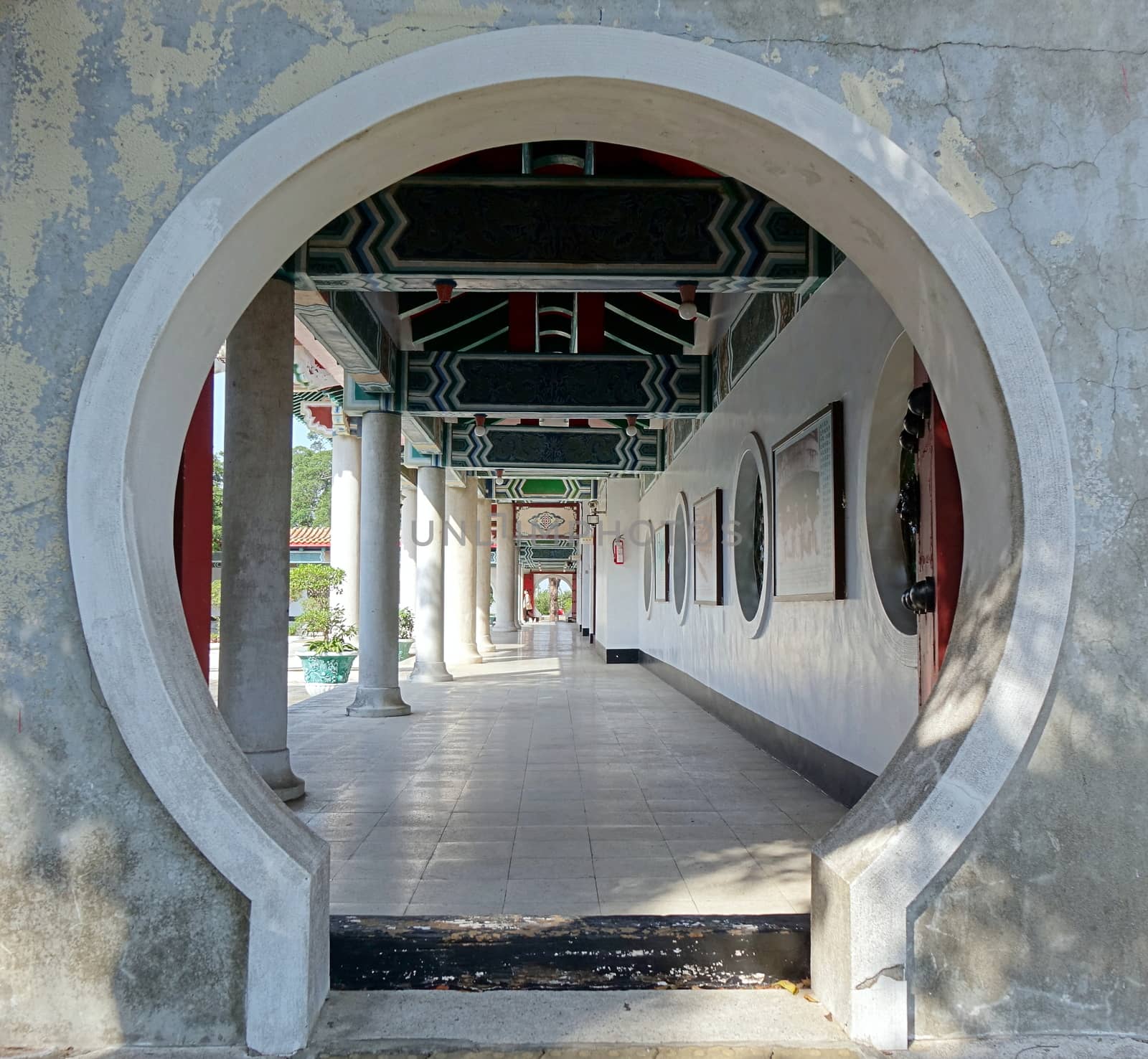 KAOHSIUNG, TAIWAN -- APRIL 29, 2017: A moon gate and corridor at the Kaohsiung Martyrs' Shrine, which is dedicated to the soldiers who died during World War Two. 