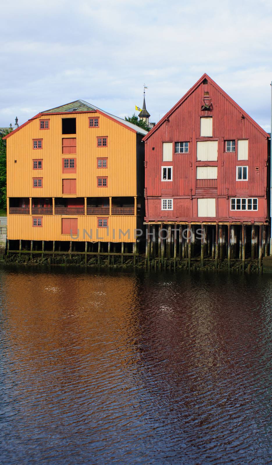 Multicolored buildings and reflection in the river, in Trondheim, Norway