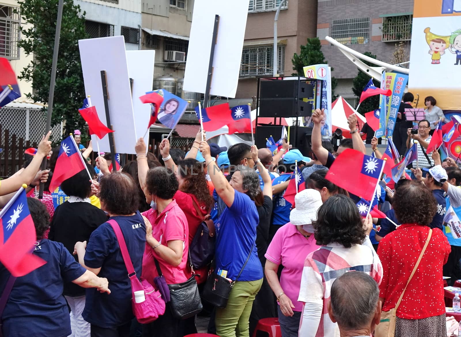 KAOHSIUNG, TAIWAN -- NOVEMBER 10, 2018: Supporters wave national flags at an election rally for KMT Kaohsiung mayor candidate Han Guo-Yun and city council member Huang Hsiang-Shu