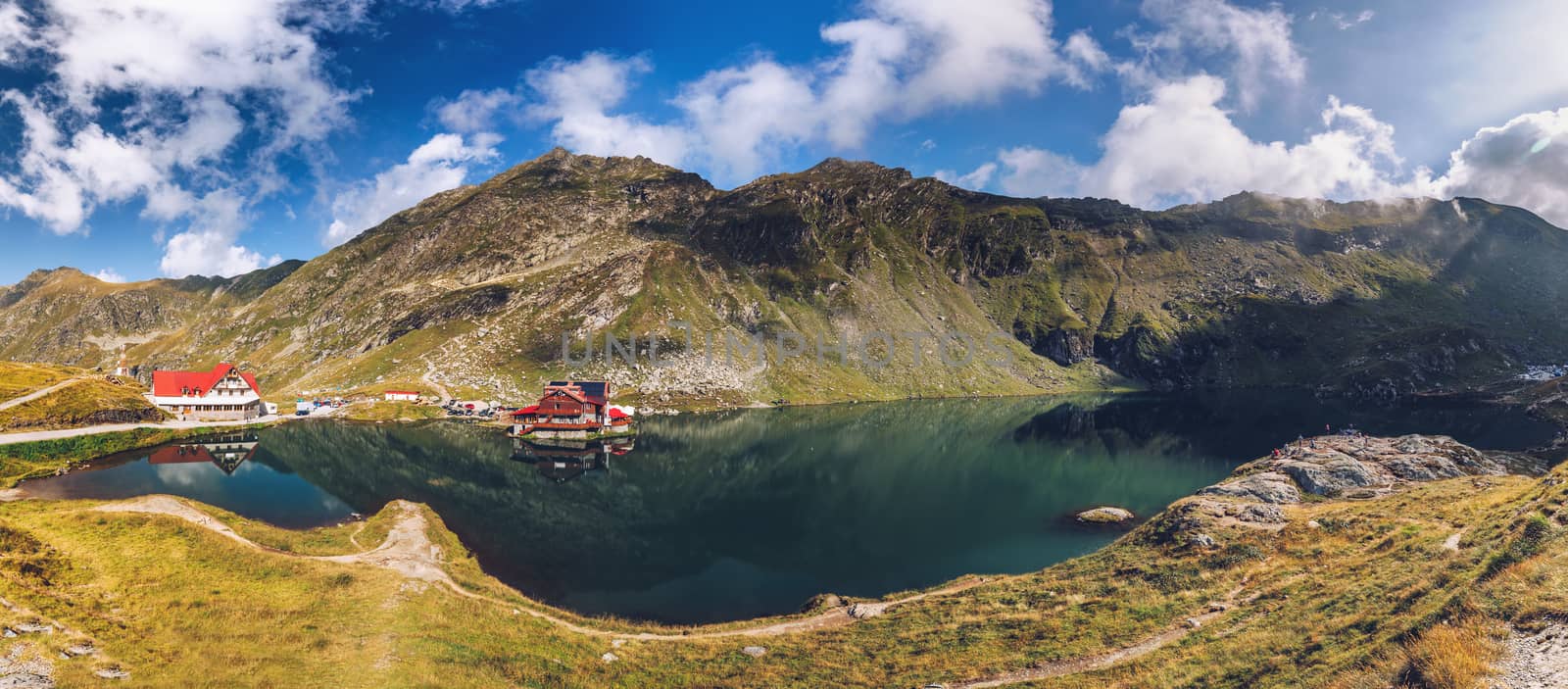 Balea glacier lake near the Transfagarasan road, panoramic view. Balea Lake, is a glacier lake situated at 2034m of altitude in the Fagaras Mountains, in central Romania, Sibiu County. 