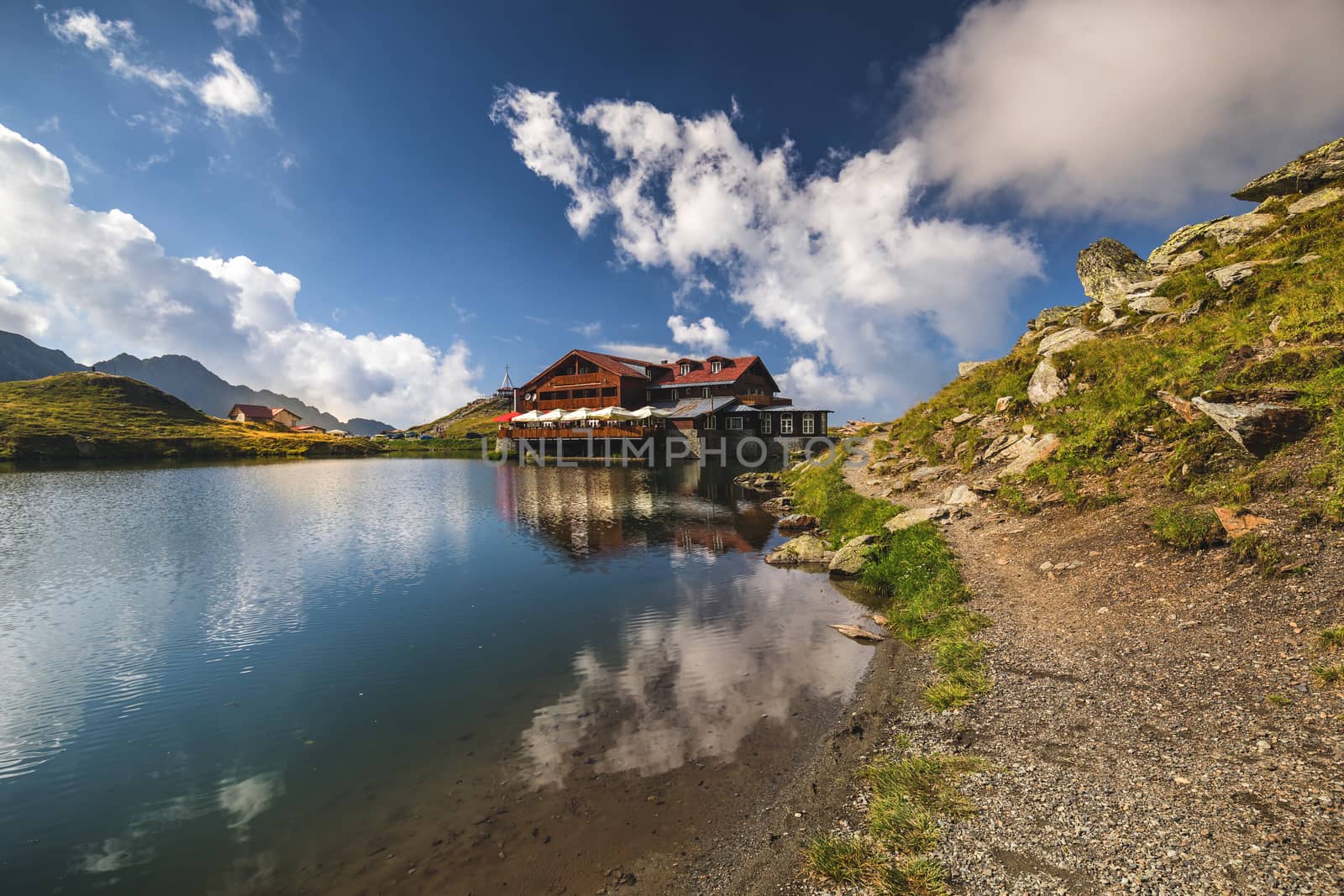 Balea glacier lake near the Transfagarasan road, panoramic view. Balea Lake, is a glacier lake situated at 2034m of altitude in the Fagaras Mountains, in central Romania, Sibiu County. 