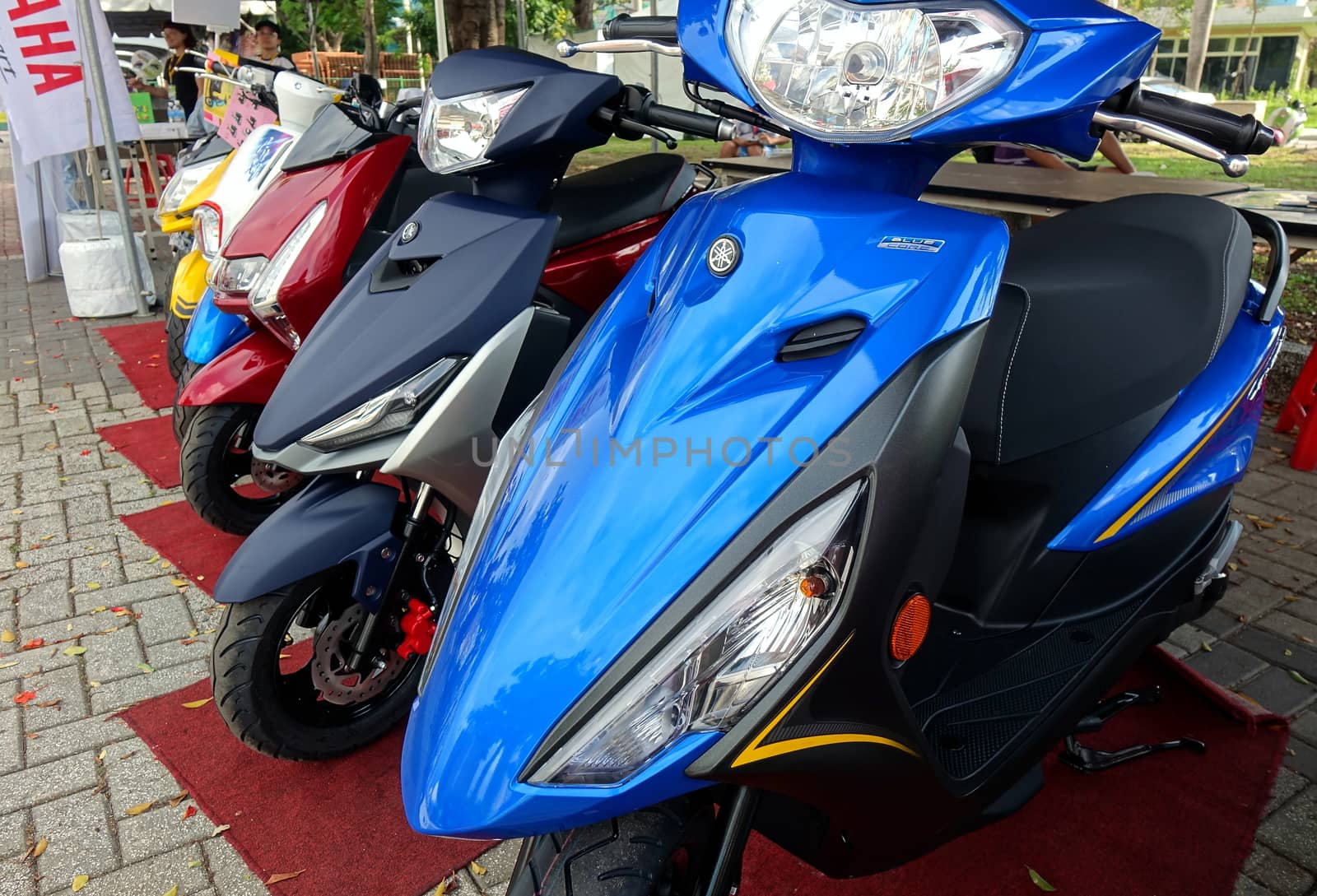 KAOHSIUNG, TAIWAN -- JUNE 30, 2018: Electric environmentally friendly scooters are on display at public event.
