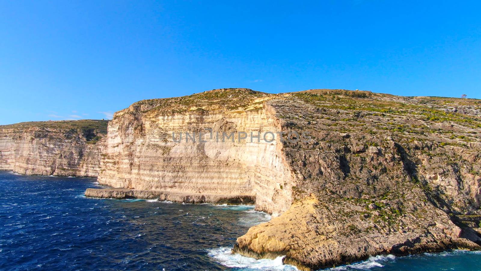 The amazing coast of Gozo - Malta with its steep cliffs - aerial photography