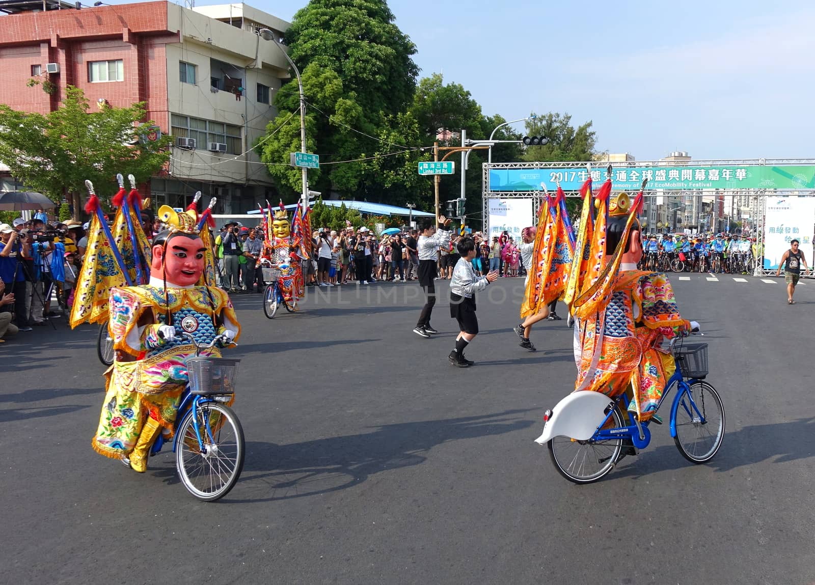 KAOHSIUNG, TAIWAN -- OCTOBER 1, 2017: Young people and traditional temple dancers perform at the opening of the 2017 Ecomobility Festival. 