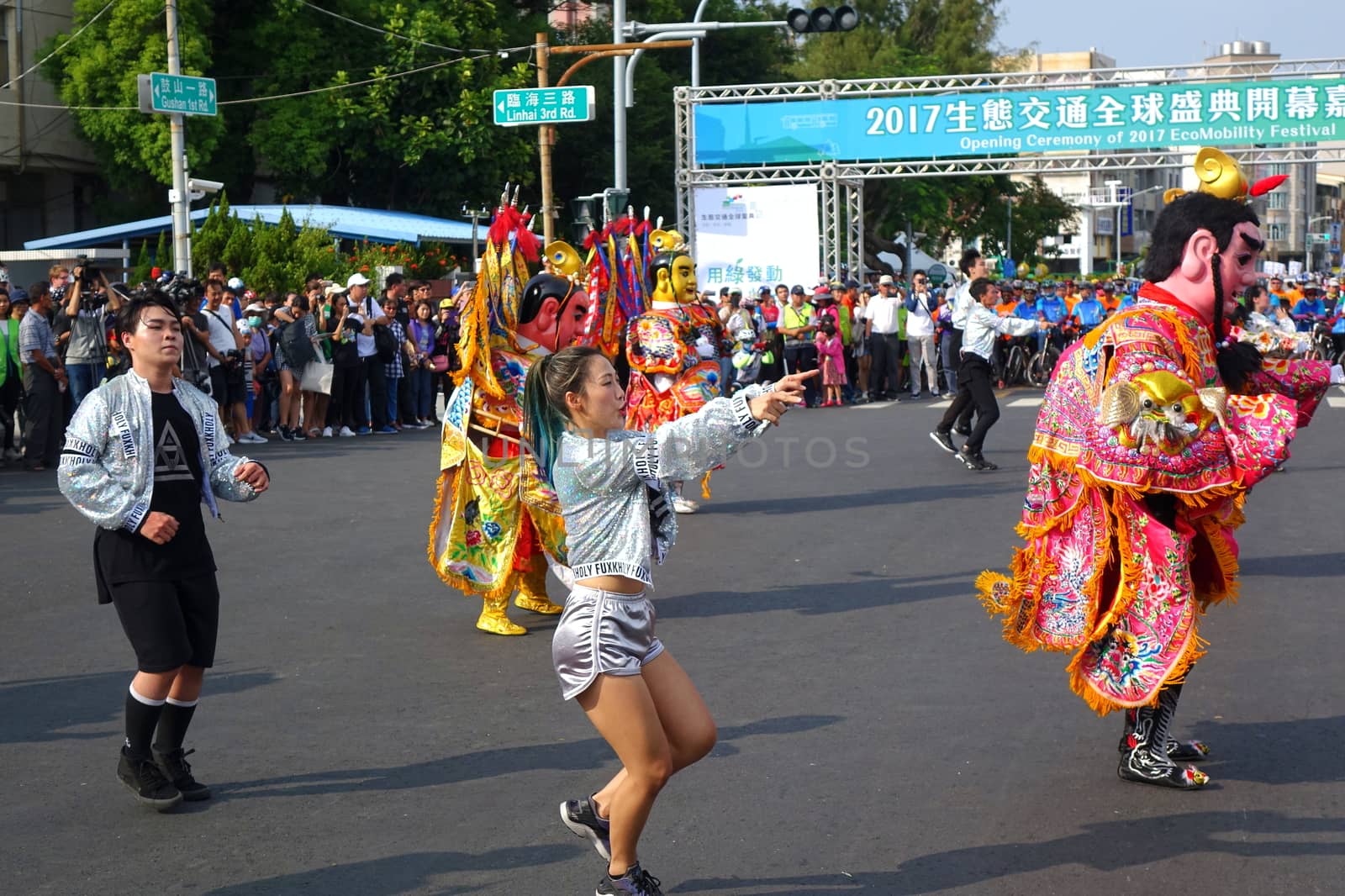 KAOHSIUNG, TAIWAN -- OCTOBER 1, 2017: Young people and traditional temple dancers perform at the opening of the 2017 Ecomobility Festival.