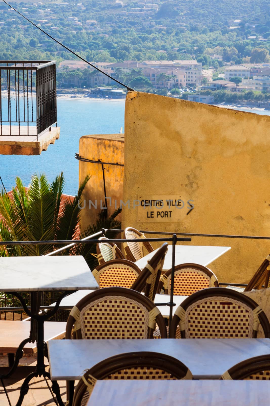 An alley in the citadel and a view of the Marina, in Calvi, The Balagne, Corsica, France