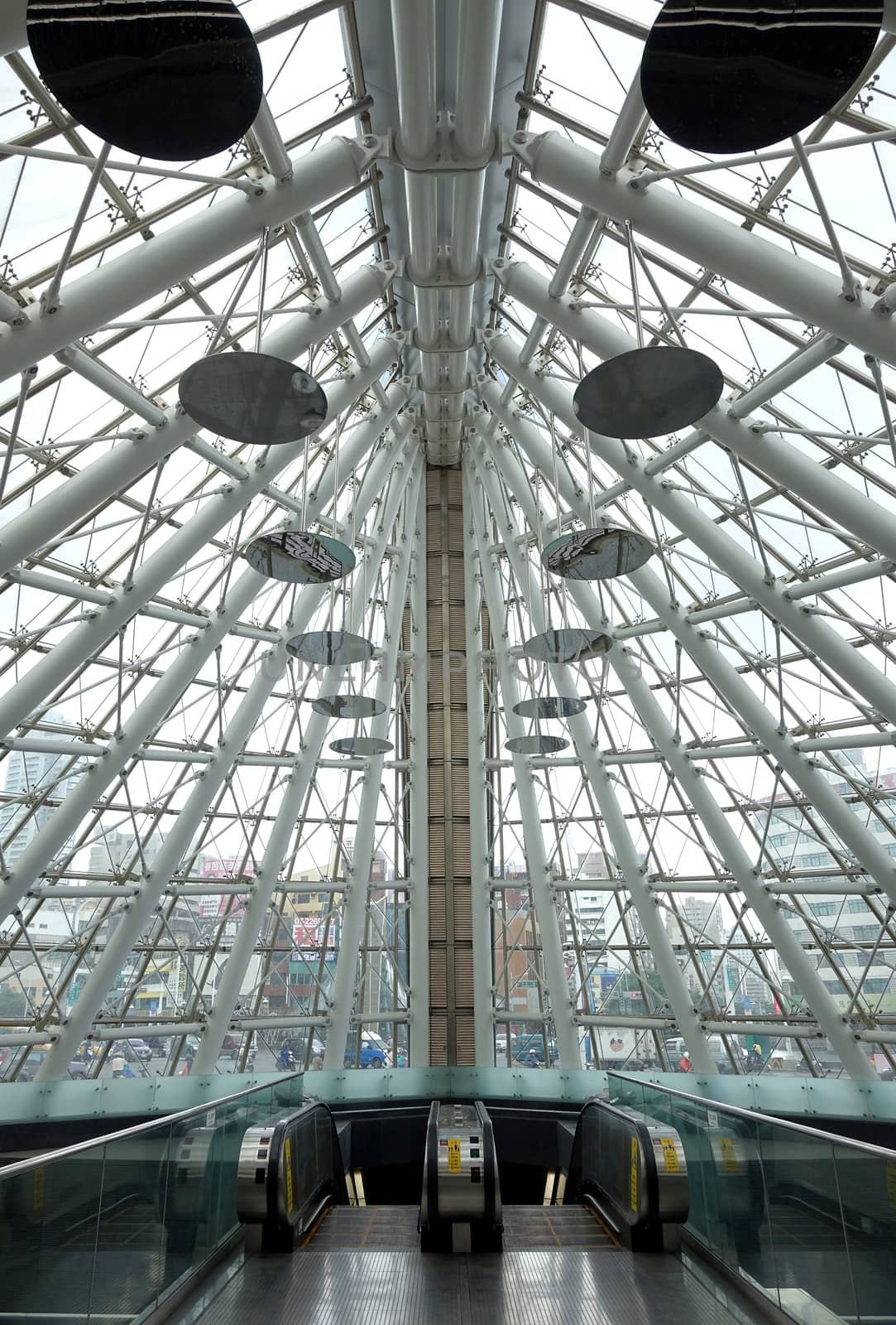 KAOHSIUNG, TAIWAN -- JUNE 26, 2014: The entrance to the Formosa Boulevard Station of the Kaohsiung City subway transportation system features a modern design with curved lines.