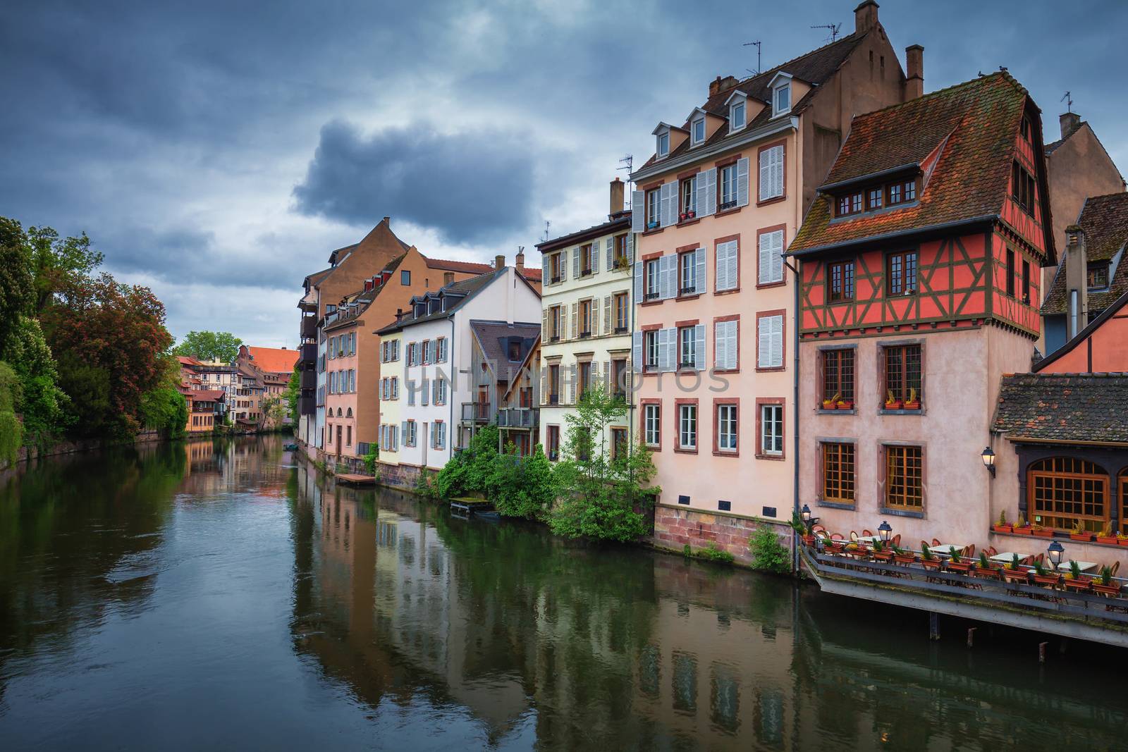 Beautiful view of the historic town of Strasbourg, colorful houses on idyllic river. Strasbourg, France