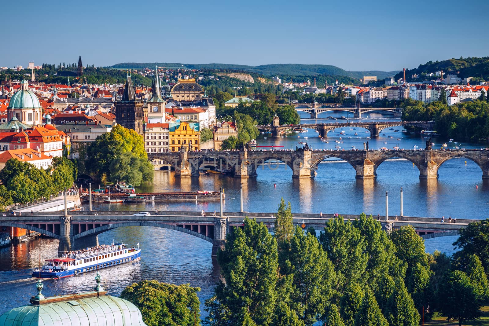 Scenic spring sunset aerial view of the Old Town pier architecture and Charles Bridge over Vltava river in Prague, Czech Republic