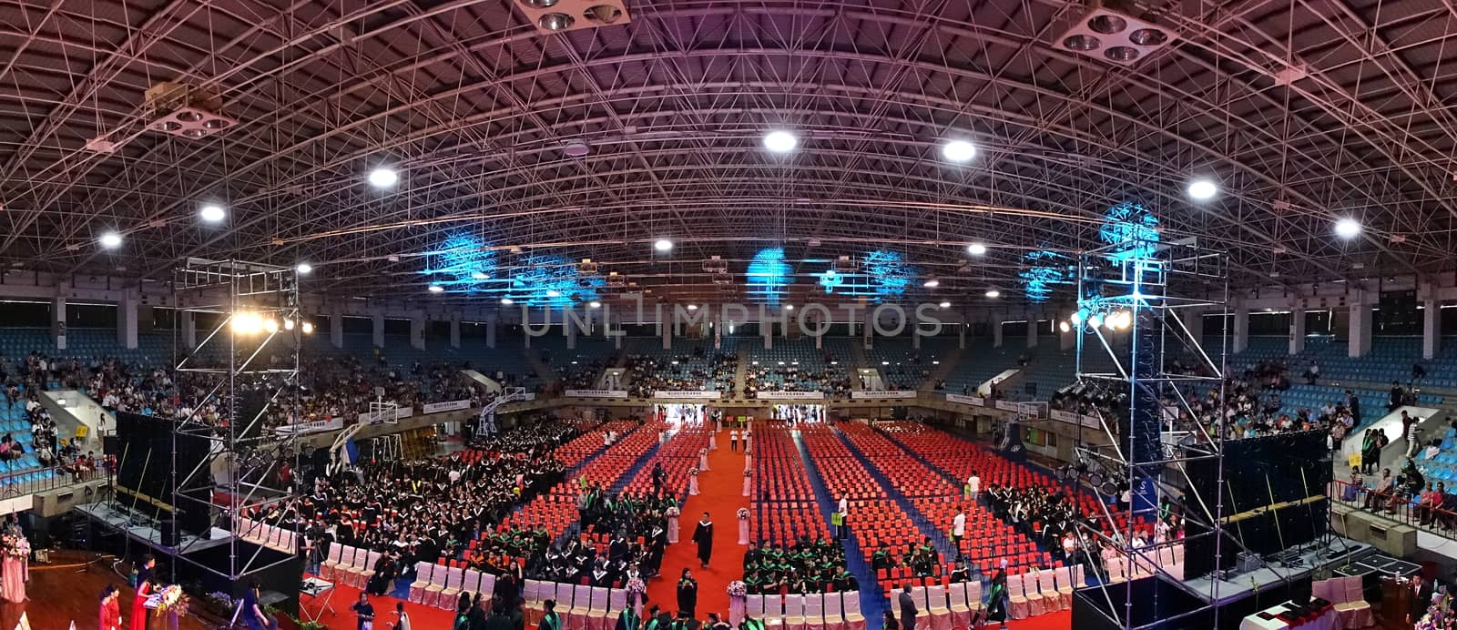 TAINAN, TAIWAN -- JUNE 2, 2018: Graduates enter a large auditorium for the annual graduation ceremony of NCKU university.