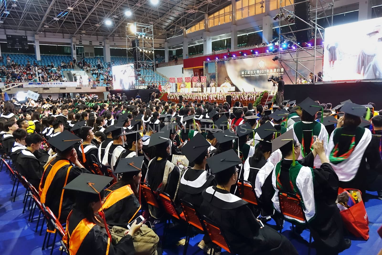 TAINAN, TAIWAN -- JUNE 2, 2018: Graduates listen to a speech at the annual graduation ceremony of NCKU university.