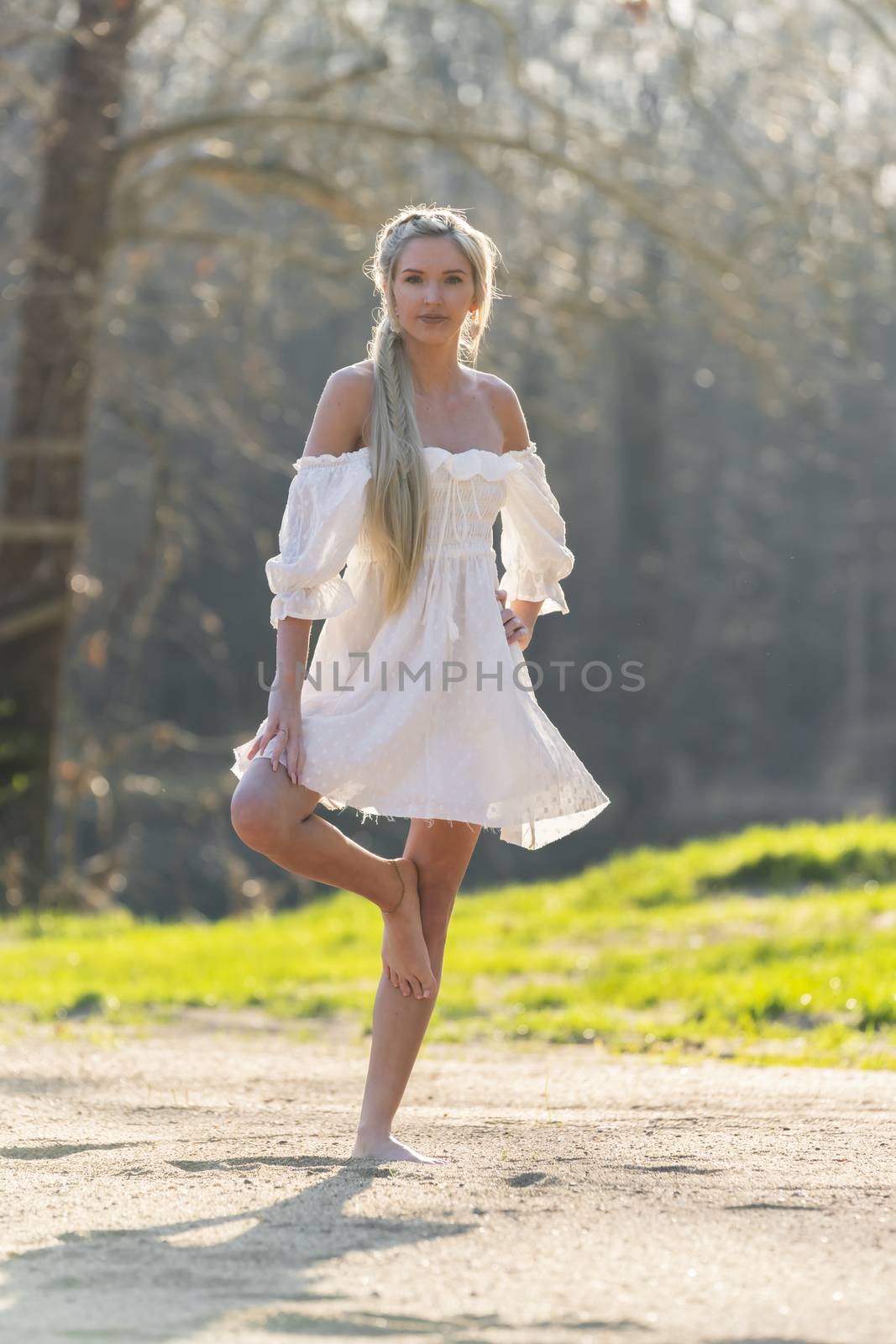 A gorgeous blonde model enjoys a spring day outdoors