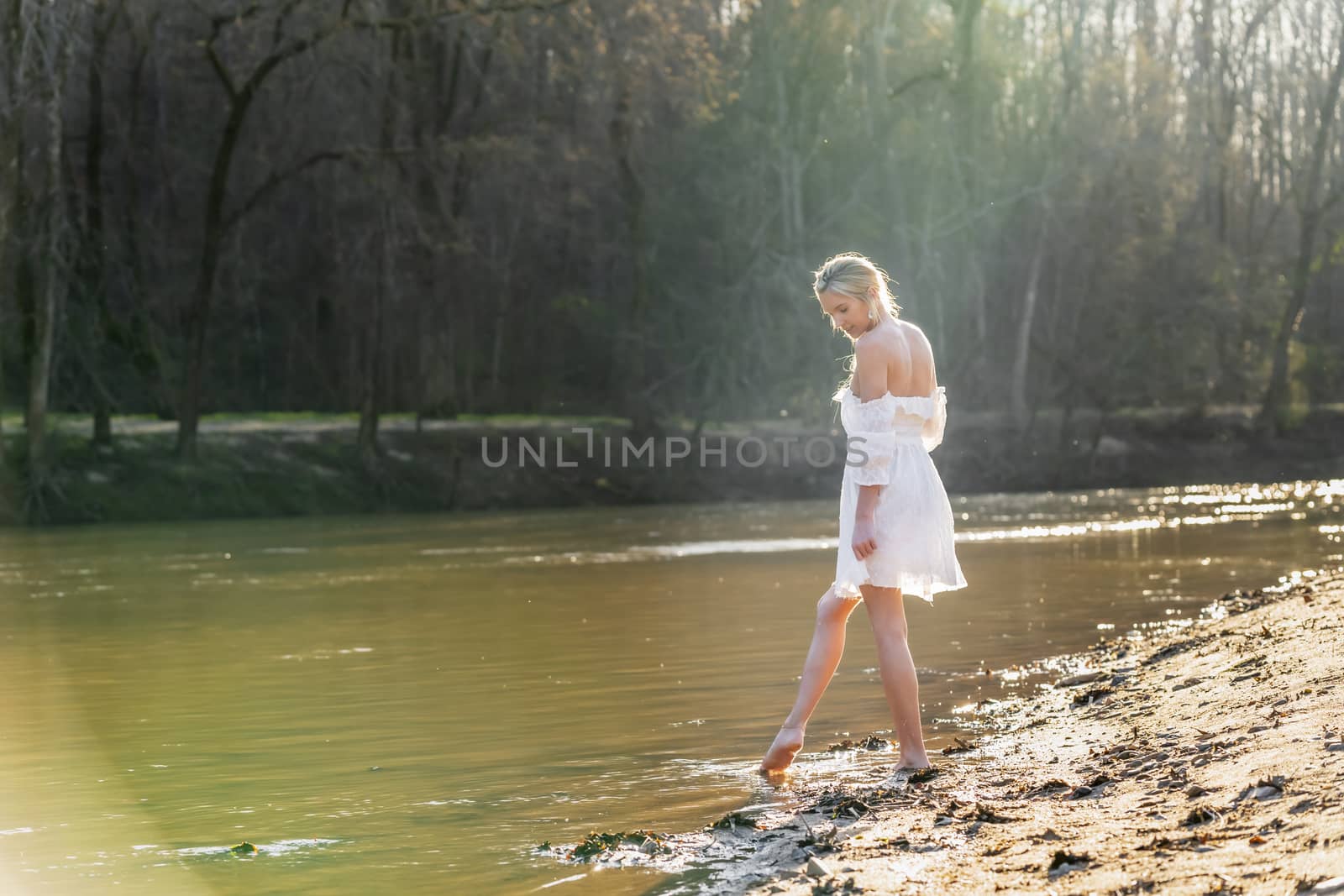 A gorgeous blonde model enjoys a spring day outdoors
