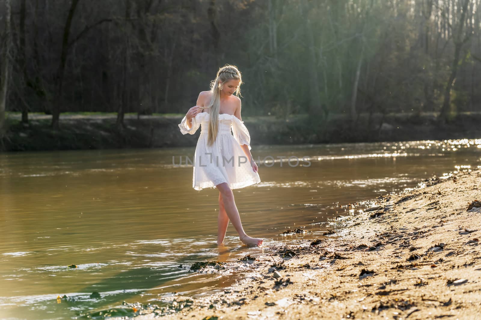 A gorgeous blonde model enjoys a spring day outdoors