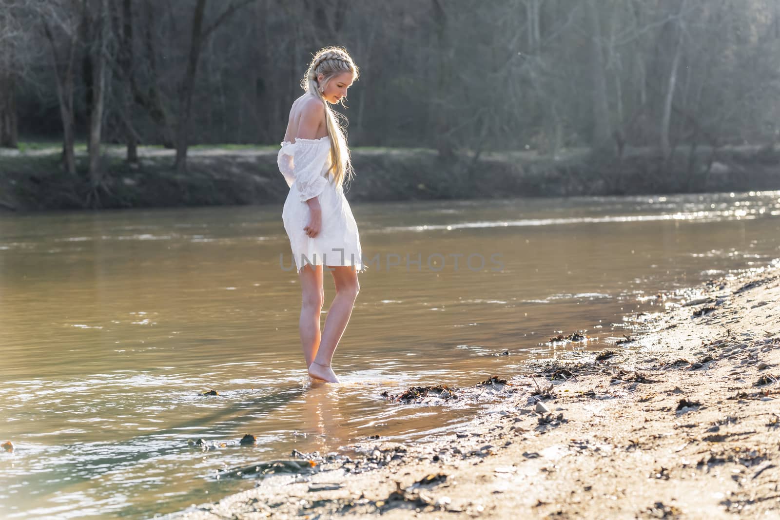 A gorgeous blonde model enjoys a spring day outdoors