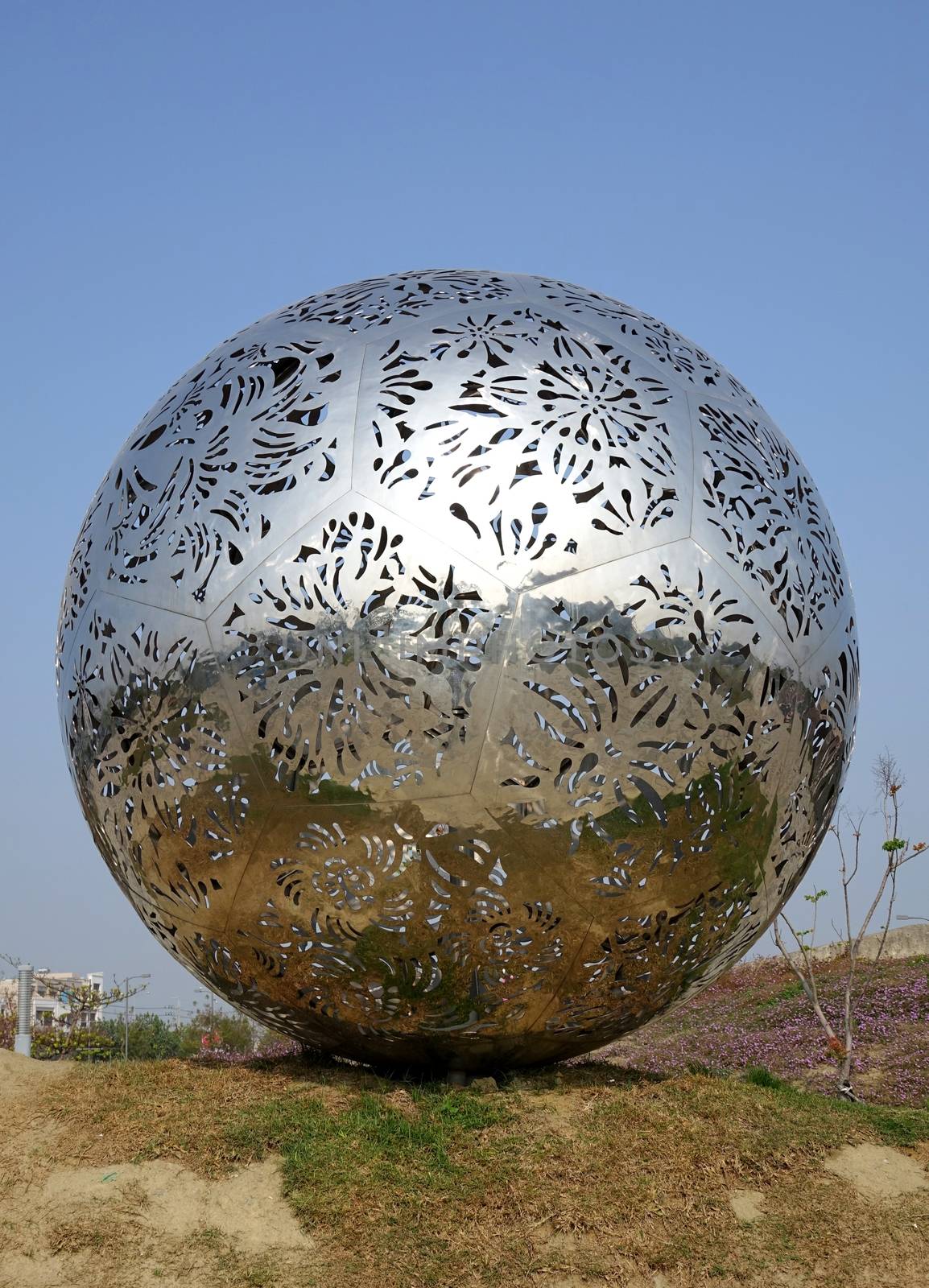 TAINAN, TAIWAN -- MARCH 4, 2014: A modern stainless steel sculpture in the park surrounding the National Museum of Taiwan History in Tainan City.