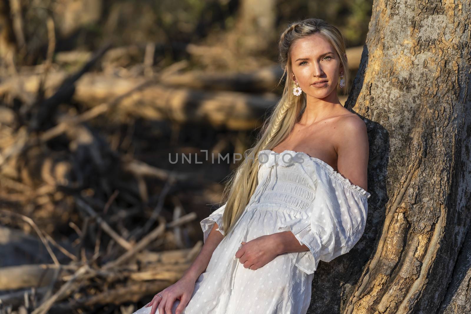 A gorgeous blonde model enjoys a spring day outdoors