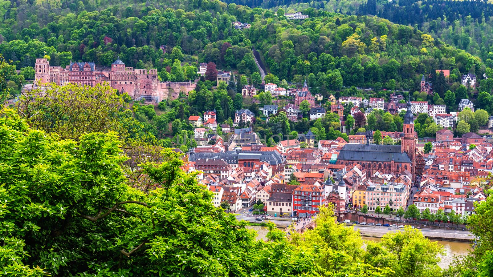 Panoramic view of beautiful medieval town Heidelberg including Carl Theodor Old Bridge, Neckar river, Church of the Holy Spirit, Germany