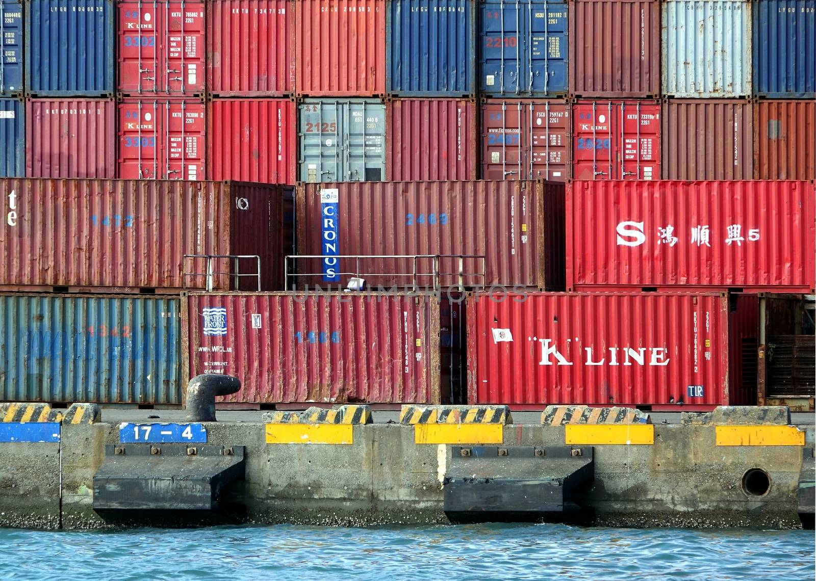 KAOHSIUNG, TAIWAN -- MAY 11, 2014: Old shipping containers are stored at a dock in Kaohsiung Harbor