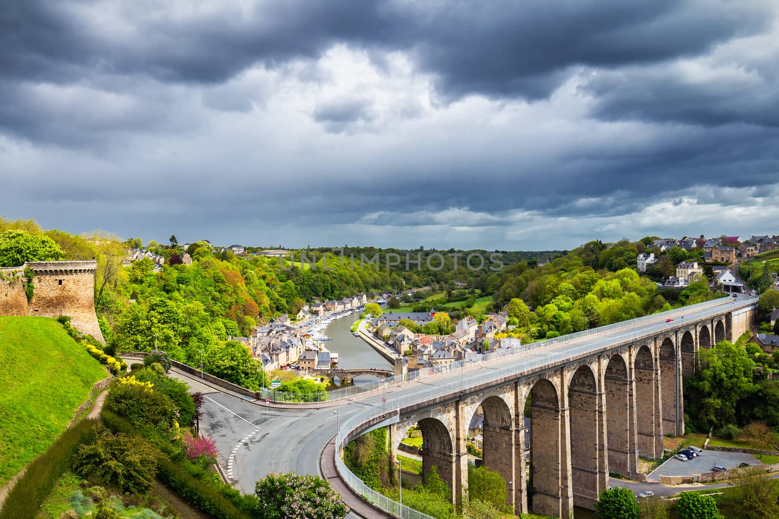 Aerial view of the historic town of Dinan with Rance river with dramatic cloudscape, Cotes-d'Armor department. Brittany (Bretagne), France