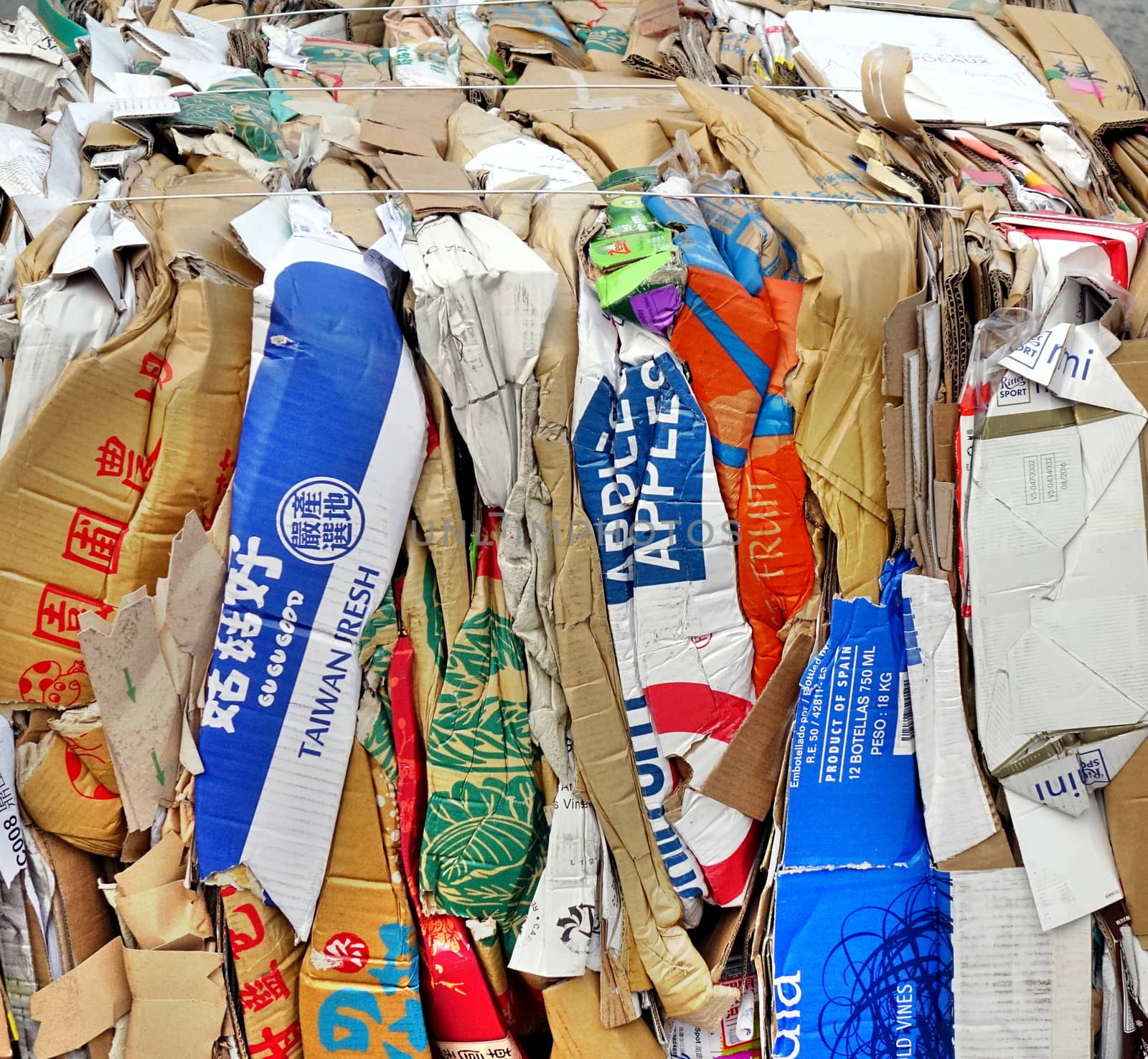 KAOHSIUNG, TAIWAN -- NOVEMBER 5, 2017: Paper, cardboard boxes and packaging has been compacted and tied up in preparation for recycling.