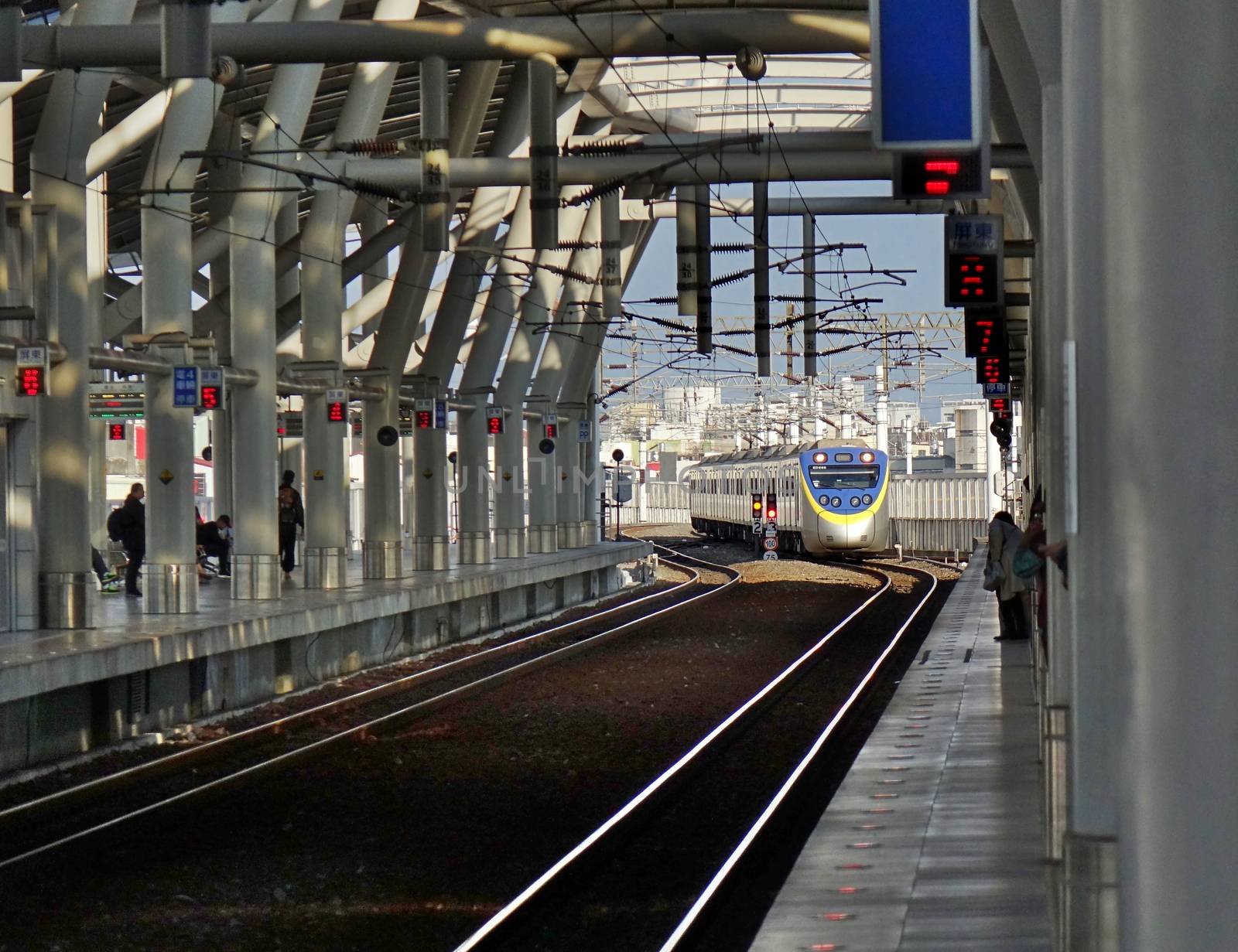 A Train Enters a New Train Station in Taiwan by shiyali