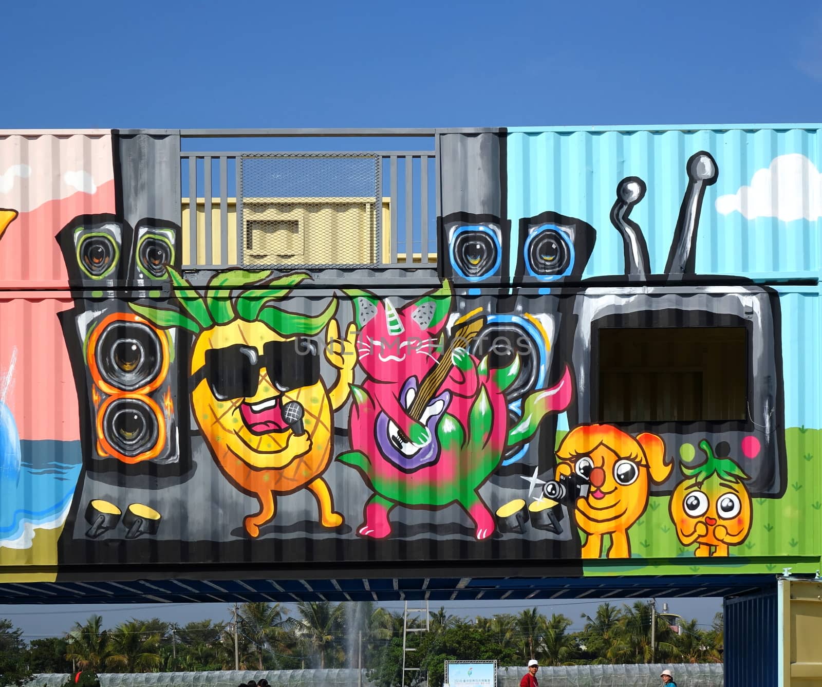 PINGTUNG, TAIWAN -- FEBRUARY 14, 2018: Shipping containers painted with colorful graffiti images form the entrance to the Pingtung Tropical Agricultural Fair.
