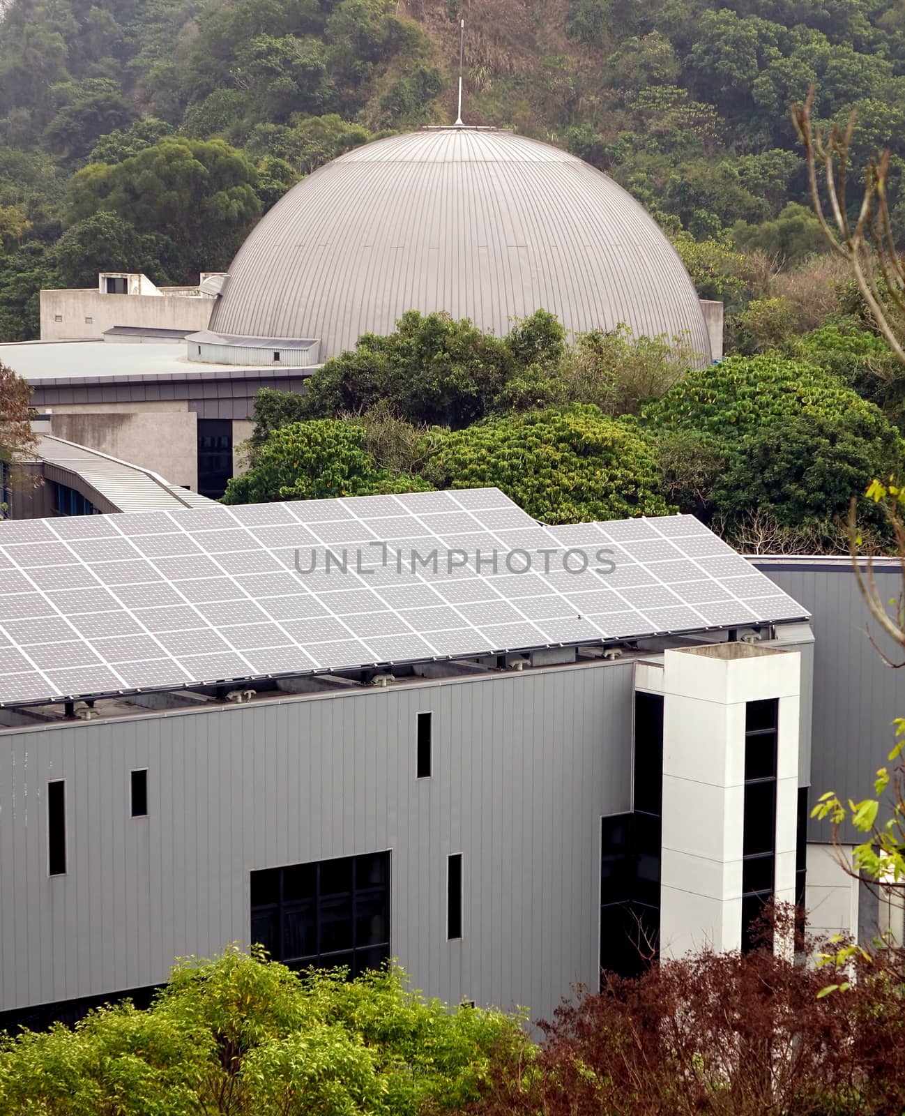 TAINAN, TAIWAN -- JANUARY 30, 2015: View of the Tainan Astronomy Education Area, in the foreground you can see the astronomy museum and in the back the planetarium.
