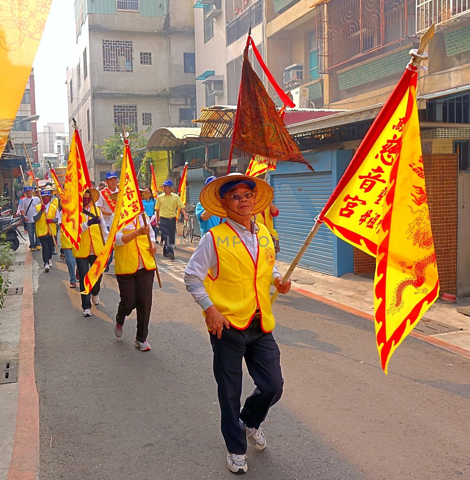 Carrying Yellow Religious Flags by shiyali