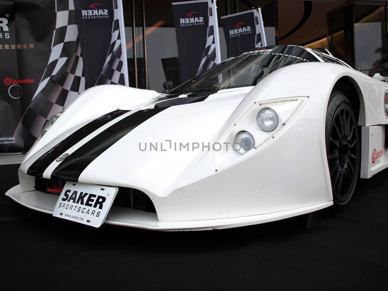 KAOHSIUNG, TAIWAN - FEBRUARY 24: To celebrate the opening of its Taiwan branch, Saker Sportscars demonstrates its RapX racing model on February 24, 2013 in Kaohsiung.