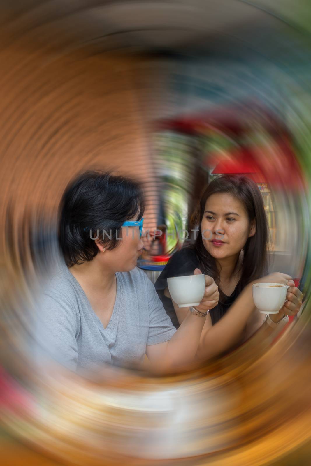 Best friends asian women drinking in coffee shop by PongMoji