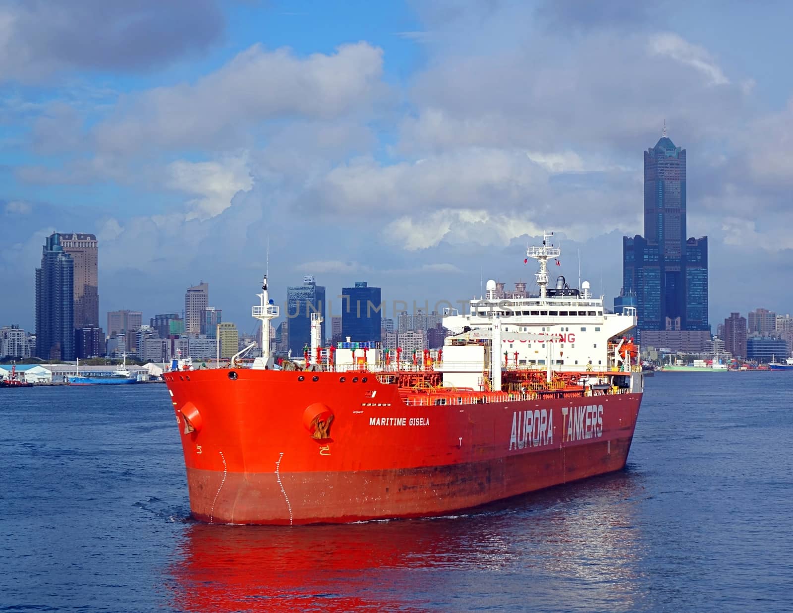 KAOHSIUNG, TAIWAN -- AUGUST 12, 2015: The Hong Kong registered oil tanker Maritime Gisela makes its way towards the Kaohsiung Port exit.

