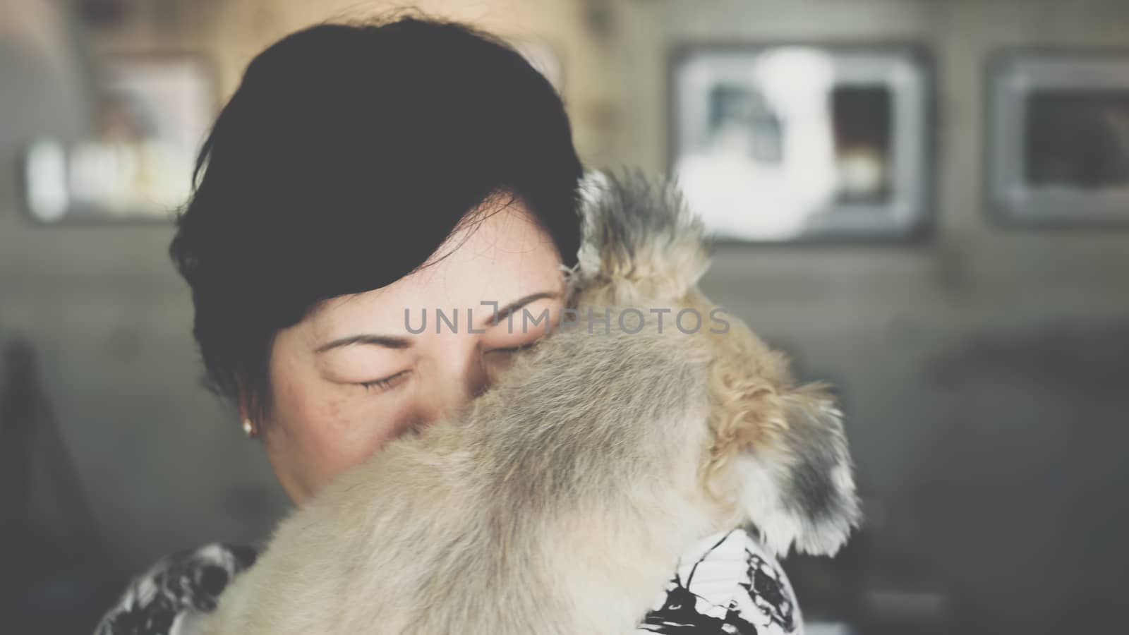 Asian women and dog in coffee shop cafe by PongMoji