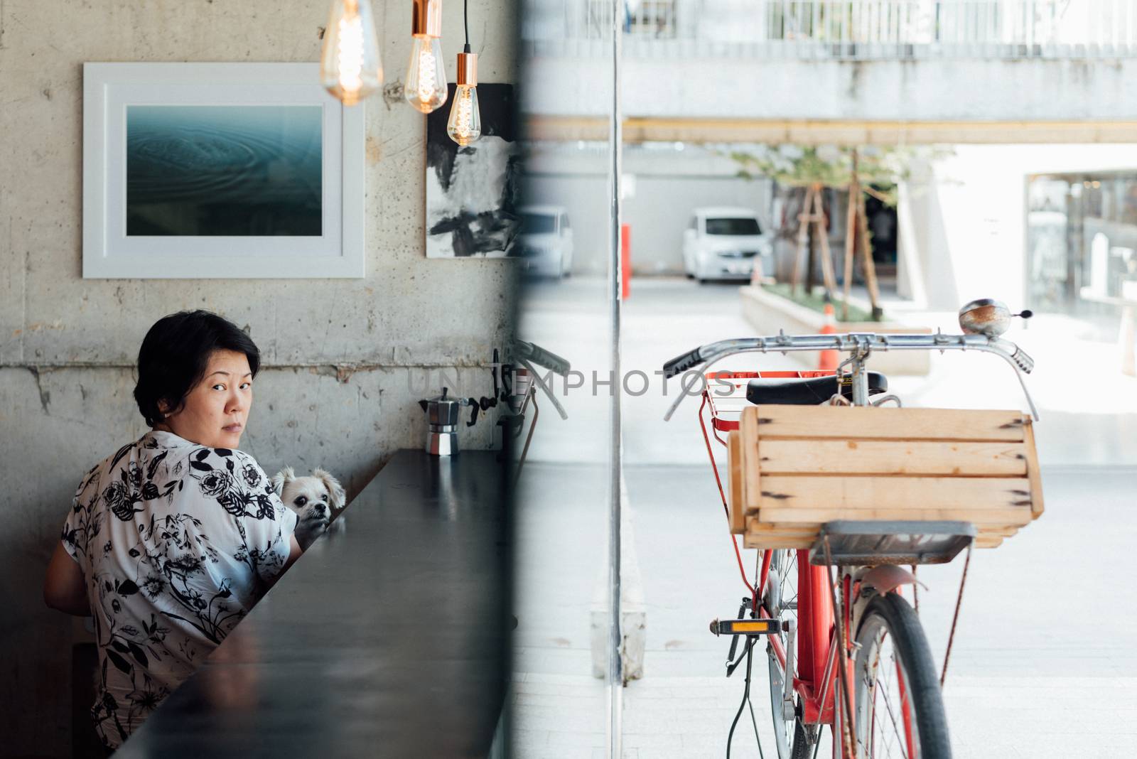 Asian women and dog in coffee shop with bicycle by PongMoji