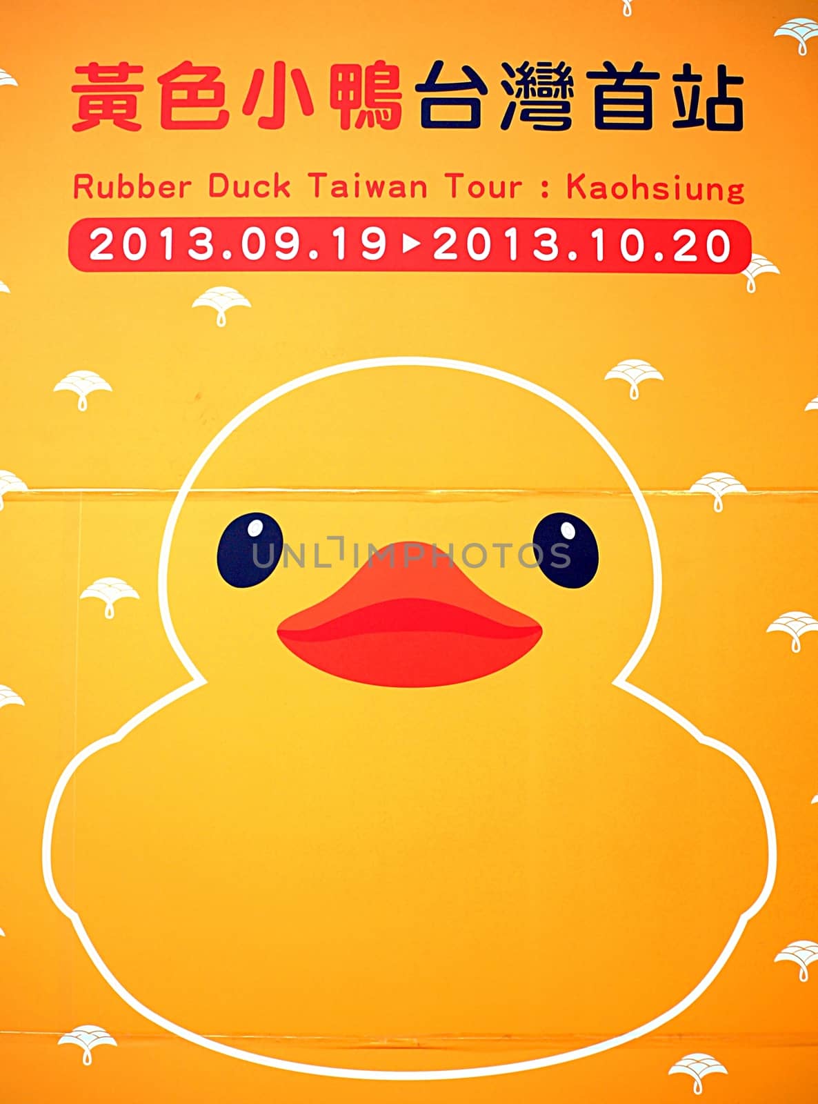 KAOHSIUNG, TAIWAN -- SEPTEMBER 28: A poster announces that the giant rubber duck designed by Dutch artist Hofman will go on display at the Glory Pier on September 28, 2013 in Kaohsiung