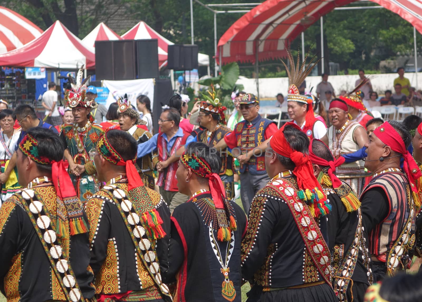 KAOHSIUNG, TAIWAN -- SEPTEMBER 28, 2019: Male members of the indigenous Rukai tribe perform a dance during the traditional harvest festival.