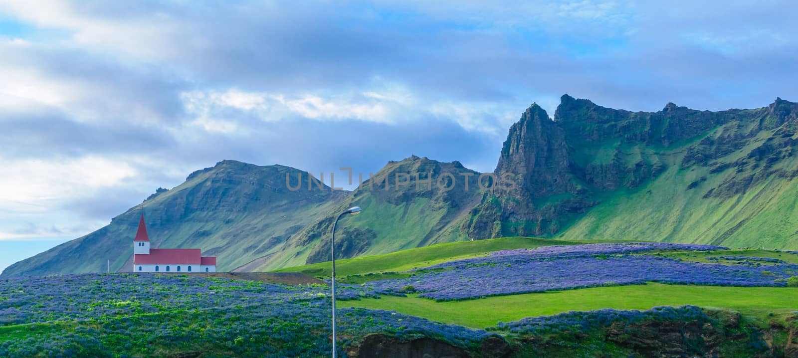 View of a church and landscape in the village Vik, in south Iceland