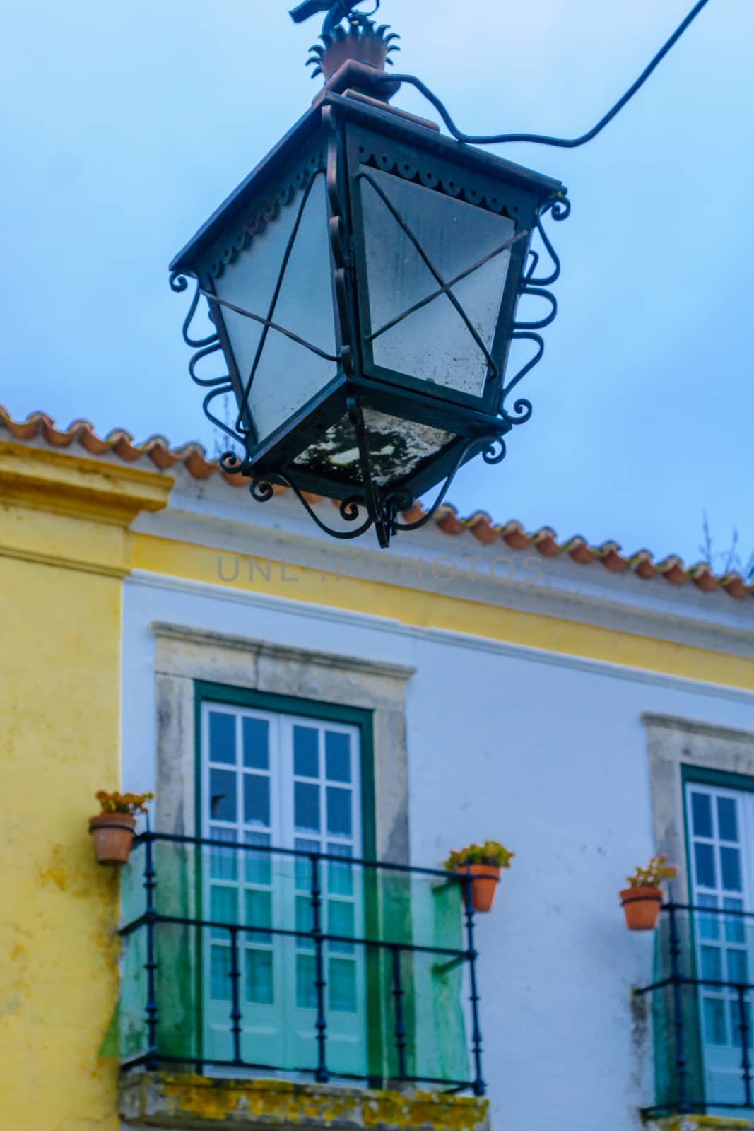 Street lamp and house windows in Obidos by RnDmS
