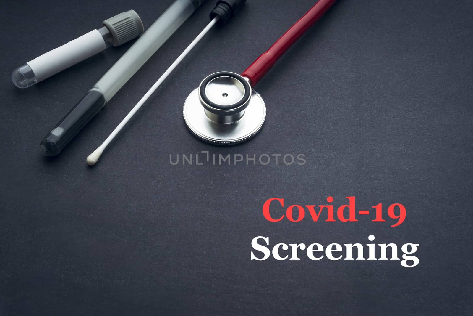 COVID-19 or CORONAVIRUS SCREENING text with stethoscope, medical swab and blood sample tube on black background. Covid-19 or Coronavirus concept. 