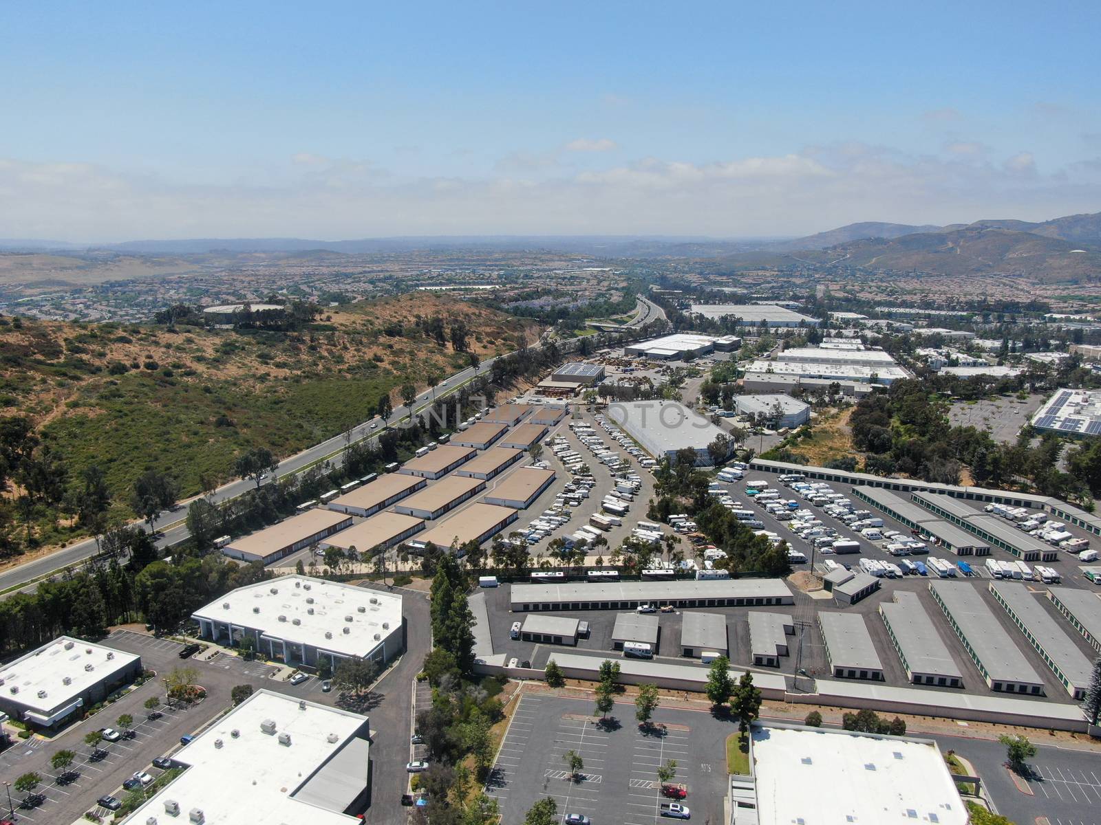 Aerial view to industrial zone and company office, storage warehouse, California by Bonandbon