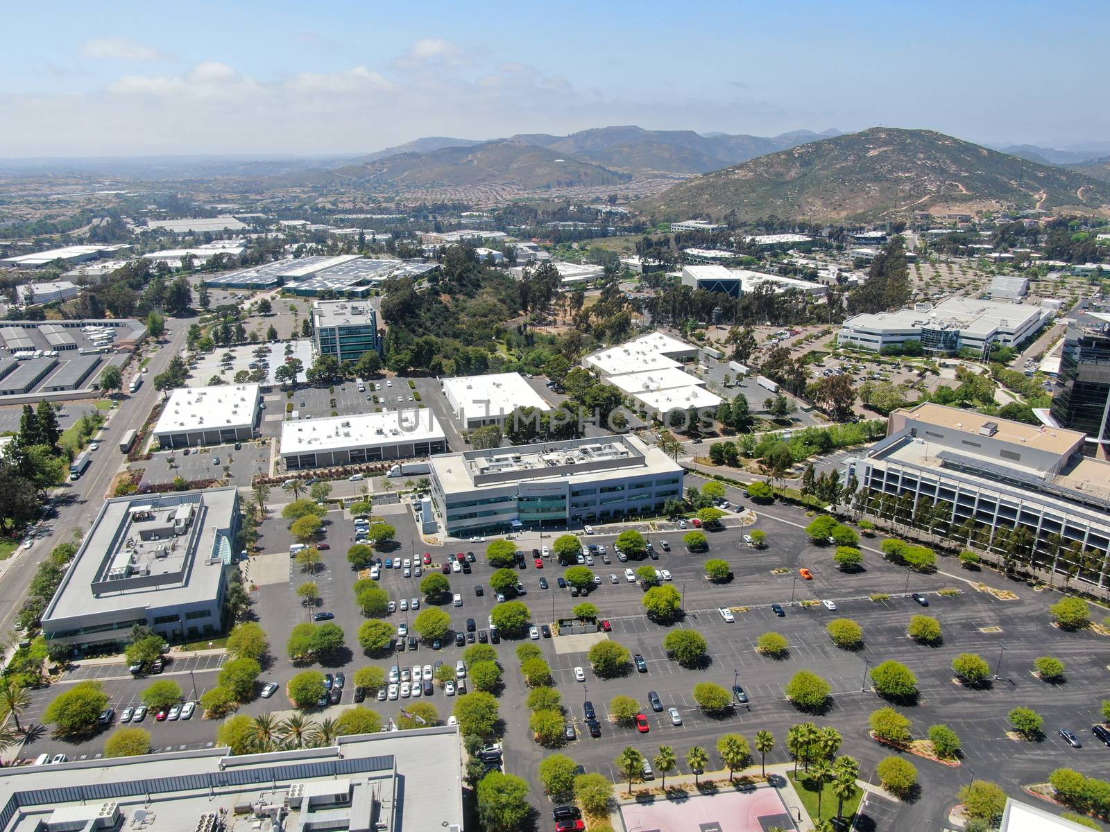 Aerial view to industrial zone and company office, storage warehouse, California by Bonandbon