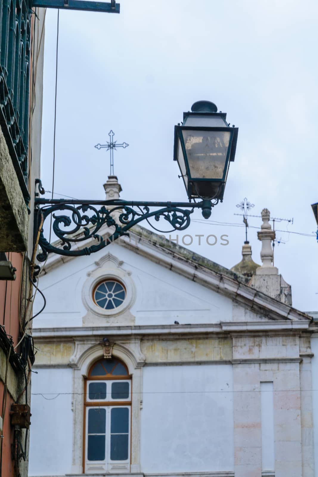 Street lamp and the Church of St. Joao da Praca, in Lisbon, Portugal