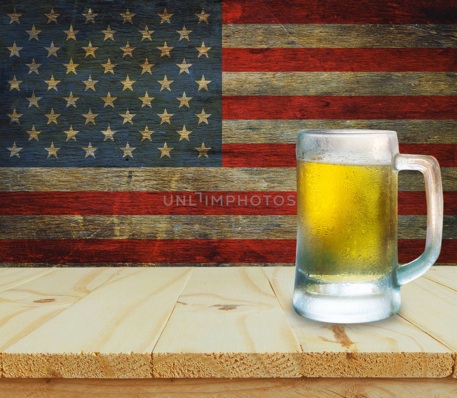 Glass of beer on wooden table. USA flag background celebrate American Independence Day of 4th July