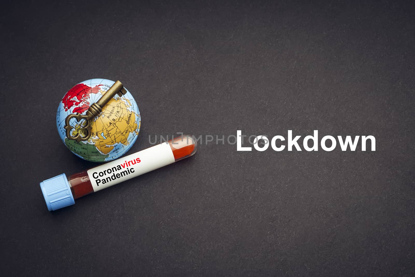 CORONAVIRUS LOCKDOWN text with world globe, key and Blood test vacuum tube on black background. by silverwings