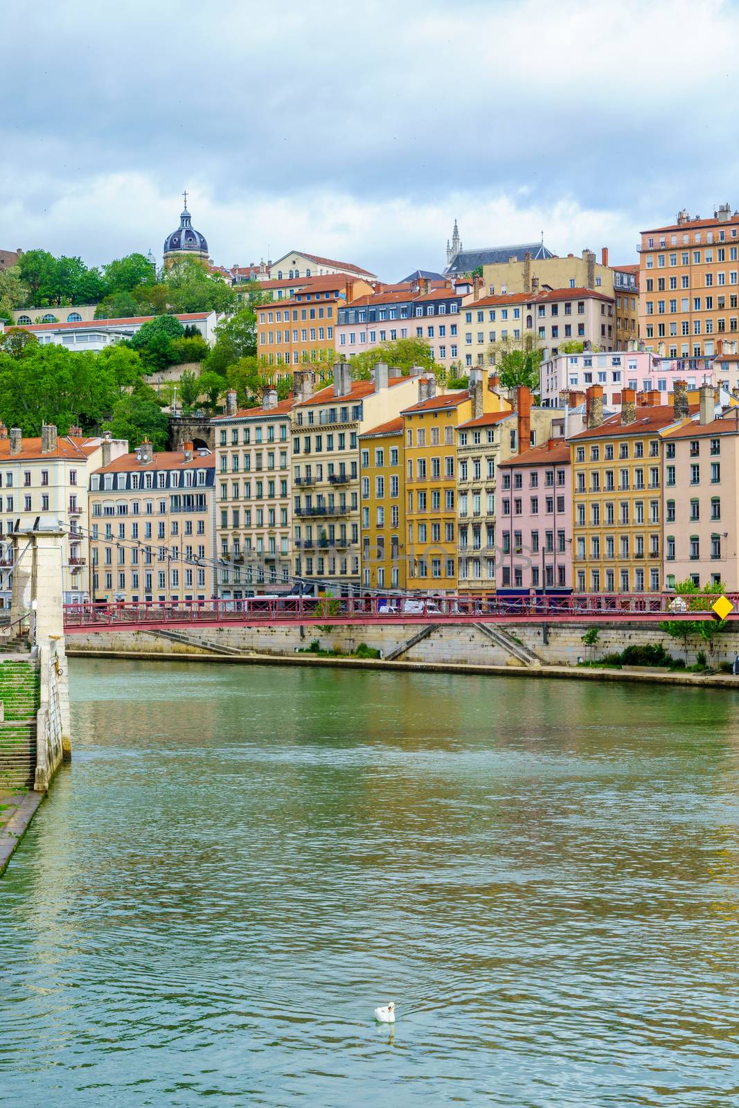 The Saint-Vincent bridge, over the Saone river, and colorful houses, in Lyon, France