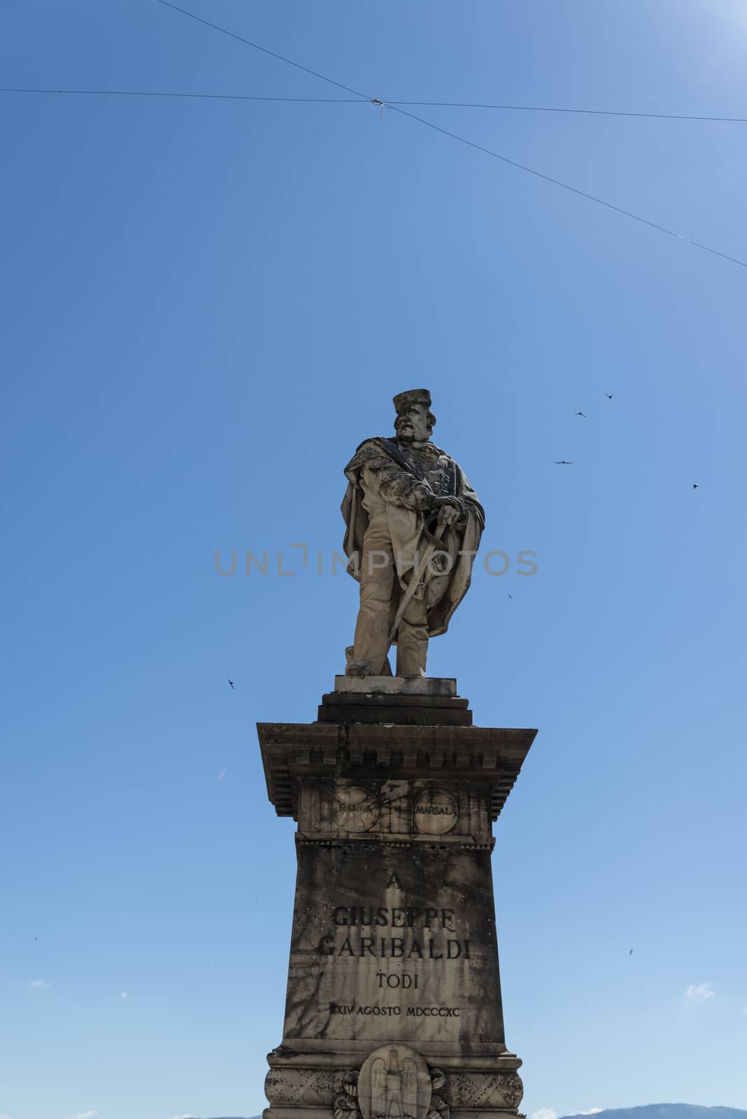 todi,italy june 20 2020 :Garibaldi monument in the center of the Garibaldi square in Todi